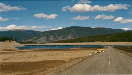 During the 2002 drought, Dillon Reservoir, one of Denver’s main sources of drinking water, dropped to a record-low level, forcing mandatory watering restrictions in the city and hampering recreation in Summit County.  Photo by Bob Berwyn