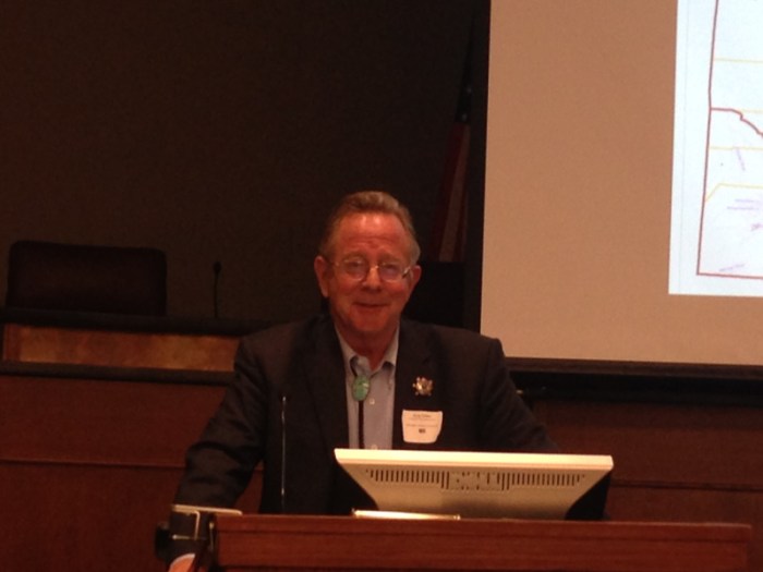 Greg Hobbs at the 2015 Martz Summer Conference (of course there is a projected image of a map -- this one was the division of Colorado into water divisions by major basin, heeding the advice of John Wesley Powell)