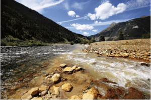 The confluence of Cement Creek, at right, and the Animas River, left, as seen September 2015 in Silverton, Colo. This is where the plume of contaminated water from the Gold King Mine entered the Animas River. (Jon Austria — The Daily Times)