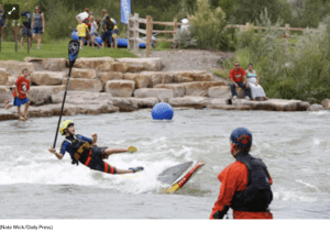 Miles Harvey of Salida takes  a spill off his standup paddle board into the Uncompahgre River during FUNC fest on Saturday
