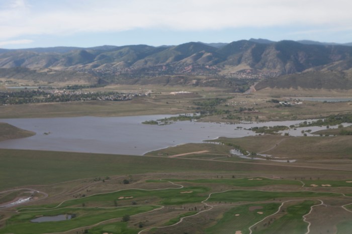 Following heavy rains which fell mid-Septembe 2013 r in Colorado, the pool elevation at the Bear Creek reservoir rose several feet. At 4 a.m., Sept. 15, the reservoir pool elevation surpassed its previous record elevation of 5587.1 feet, and peaked at a pool elevation of 5607.9 ft on Sept. 22, shown here. Bear Creek Dam did what it was designed to do by catching the runoff and reducing flooding risks to the hundreds of homes located downstream.