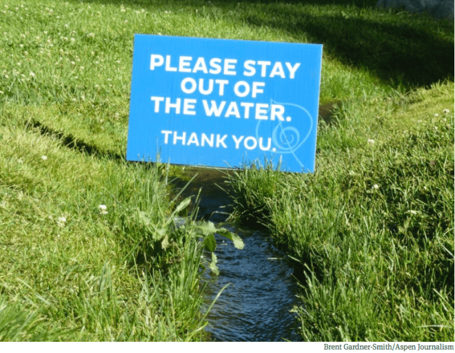 This sign, on the irrigated lawn outside the Aspen music tent, could well sum up how Front Range and Western Slope water organizations view each other.