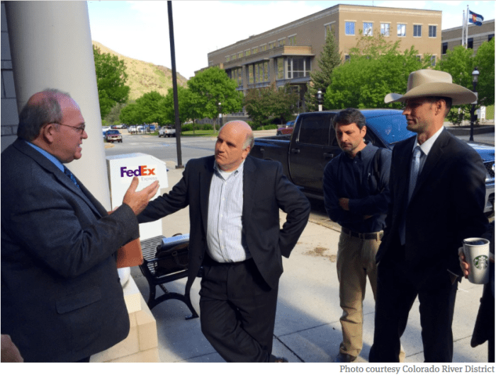 From left, Russ George, a CWCB board member, Andrew Gorgey, then Garfield County manager, Peter Fleming, general counsel for the Colorado River District, and James Eklund, director of the CWCB, talking about the potential for new transmountain diversions outside of the Garfield County building in Glenwood Springs in 2015.
