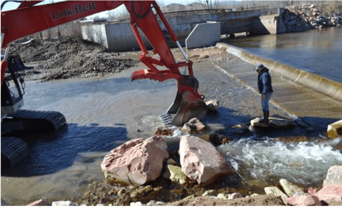 Crews put the finishing touches on a new diversion structure on the Poudre River near the Environmental Learning Center just west of Interstate 25 [February 2016]. Specialists used rocks to create just the right shape and size of pool, at right, at the edge of a passage for native fish species. (Fort Collins Natural Areas / Special to the Reporter-Herald)