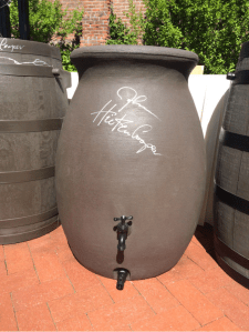 Governor Hickenlooper signed a rain barrel at the HB16-1005 bill signing ceremony. Photo via @jessica_goad and Twitter.