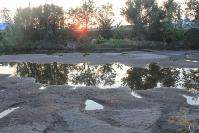 In early August 2012, this is what the South Platte River looked like north of downtown Denver, near the Cherokee power plant. Photo/Allen Best .