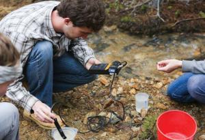 Junior environmental engineering students measure water quality parameters for their field session client, Clear Creek Watershed Foundation. (Credit: Deirdre O. Keating)