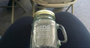 All that was left at the end of 75 minutes of speeches was to have a sip of SDS water. Photo via the Colorado Springs Independent.